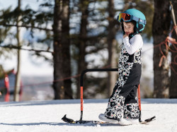 Young snowboarder uses the Burton handlebar