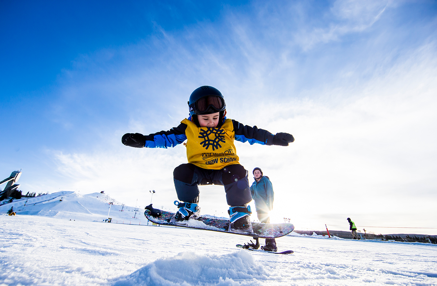 Winsport Snowboard youngchildonsnowboardtakesajump
