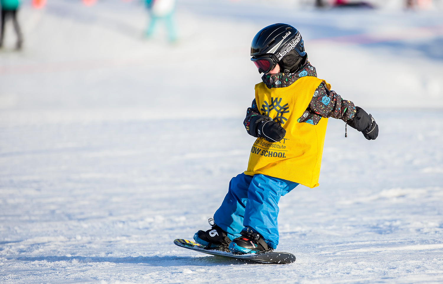 Young snowboarder in lessons at WinSport