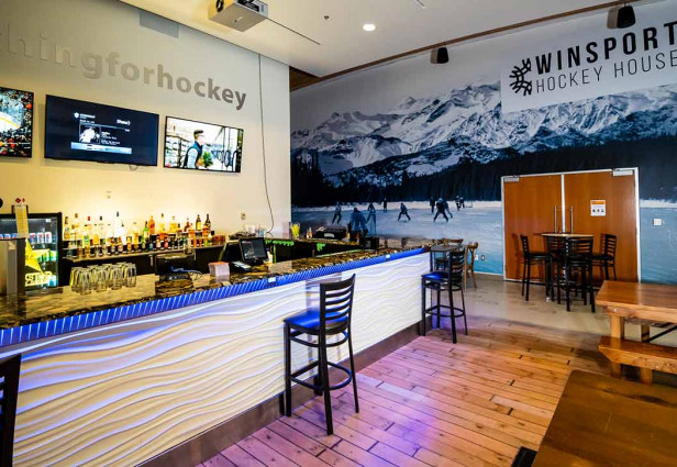 Wide angle of the WinSport Hockey House showcasing the bar