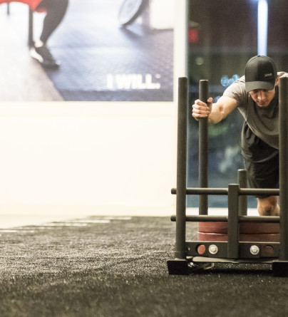 Adult male pushing weights at winsport 