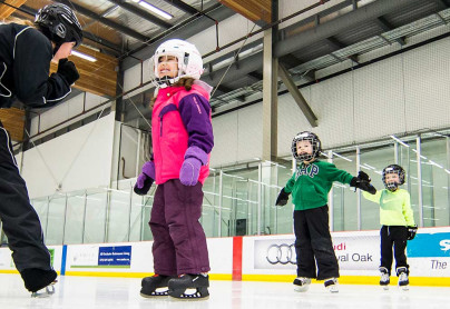 Group of youth participants learning how to skate