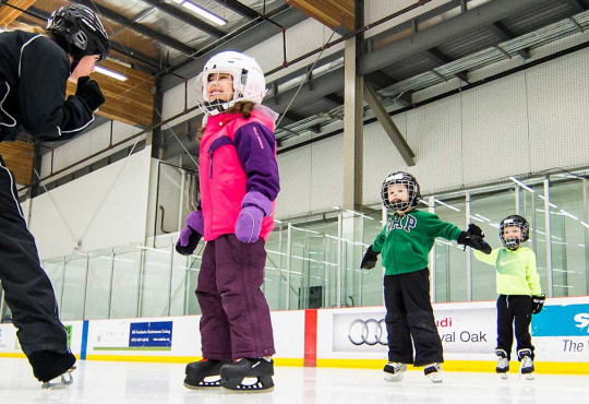 Group of youth participants learning how to skate