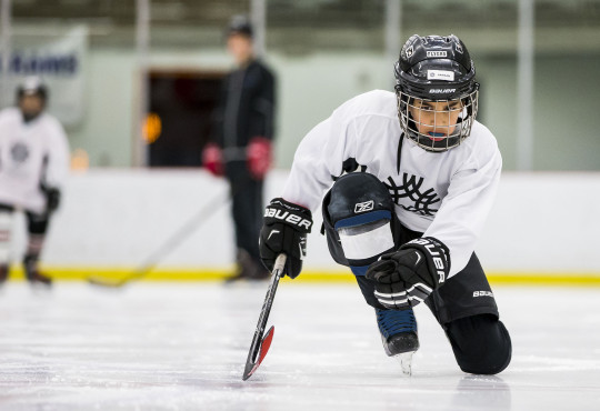 Winsport Youthhockey boykneelingonice