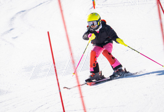 Alpine skier learning to race down the winsport winter hill