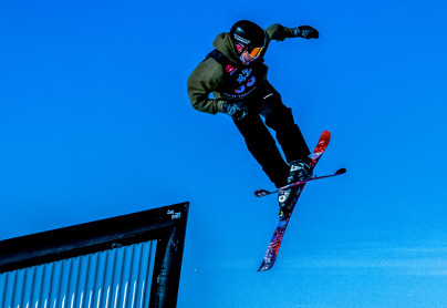 skiier exiting a rail at the alpine hill at winsport