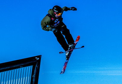 skiier exiting a rail at the alpine hill at winsport