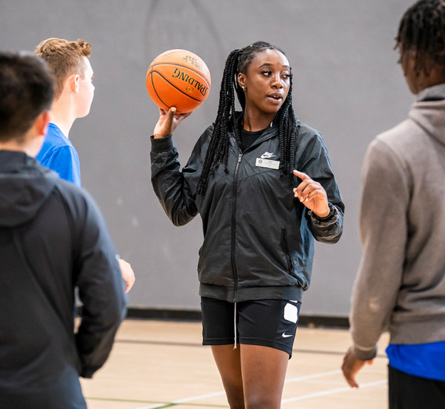 WinSport instructor teaching a class how to do the basketball v2