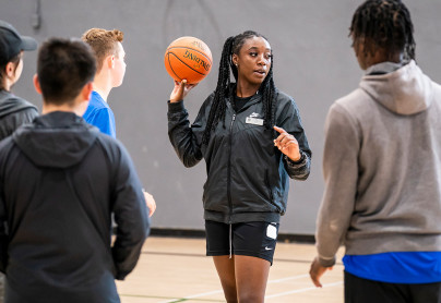 WinSport instructor teaching a class how to do the basketball v2