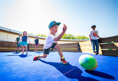 Children playing gaga ball on a court at WinSport