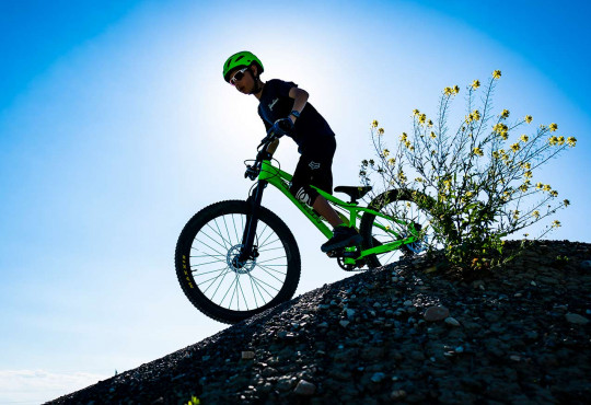 Winsport SummerCamps youngboyridinghisbikeoveraberm